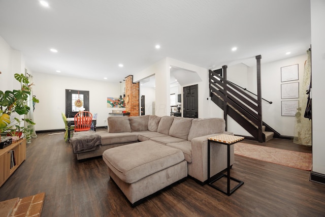 living room with dark wood-style floors, recessed lighting, stairs, and baseboards