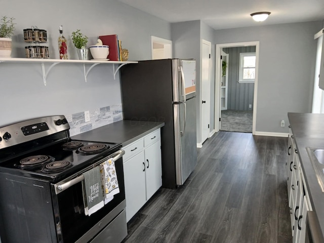 kitchen featuring dark countertops, open shelves, white cabinets, dark wood finished floors, and appliances with stainless steel finishes