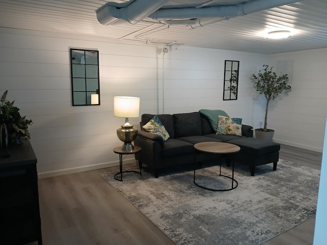 living room with wood finished floors and baseboards