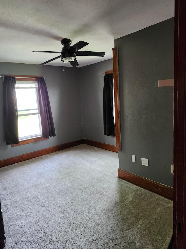 317 N High St, New Lexington, OH 43764 - unfurnished room featuring carpet floors, baseboards, and ceiling fan