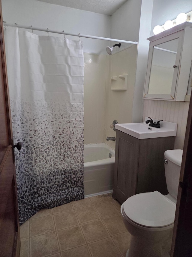 317 N High St, New Lexington, OH 43764 - full bath with vanity, toilet, tile patterned floors, and shower / bath combo with shower curtain