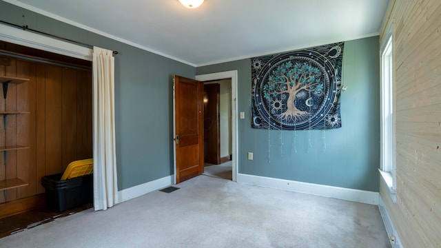 317 N High St, New Lexington, OH 43764 - unfurnished bedroom with carpet, baseboards, multiple windows, and ornamental molding