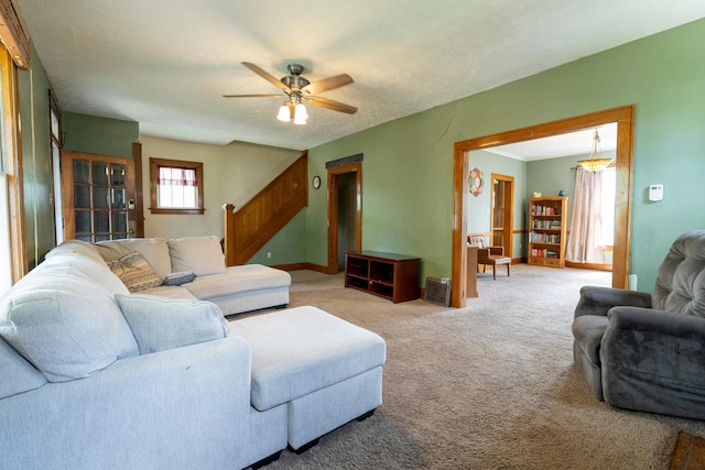 317 N High St, New Lexington, OH 43764 - carpeted living room featuring a ceiling fan, stairway, and baseboards