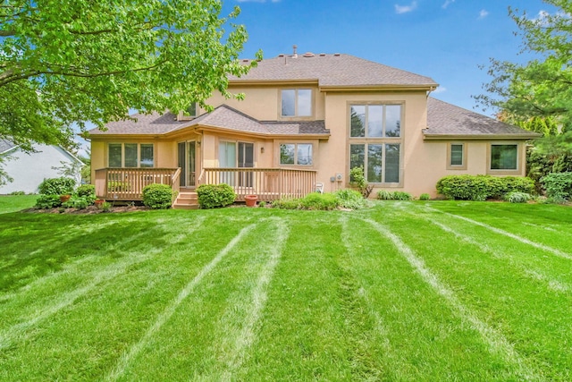 6180 Storm Haven Ct, Lewis Center, OH 43035 - back of property featuring stucco siding, a deck, and a lawn