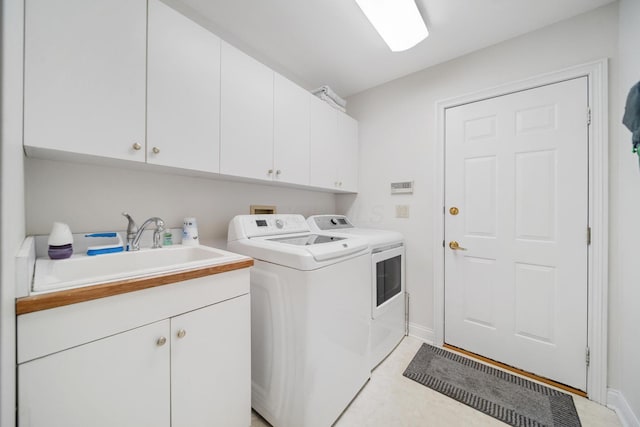 6180 Storm Haven Ct, Lewis Center, OH 43035 - laundry room featuring cabinet space, washing machine and dryer, and baseboards