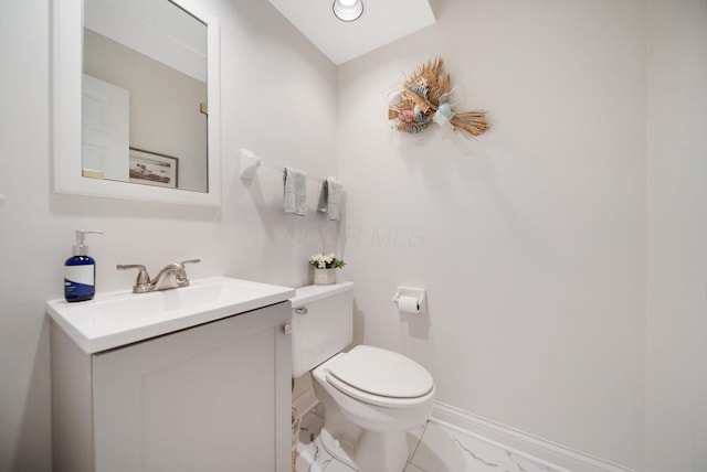 6180 Storm Haven Ct, Lewis Center, OH 43035 - bathroom featuring toilet, vanity, baseboards, and marble look tiles