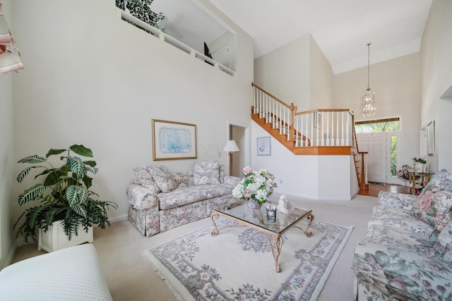 6180 Storm Haven Ct, Lewis Center, OH 43035 - carpeted living area featuring a towering ceiling, stairway, baseboards, and a chandelier