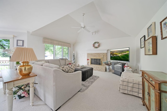 6180 Storm Haven Ct, Lewis Center, OH 43035 - living room featuring healthy amount of natural light, ceiling fan, carpet floors, a brick fireplace, and vaulted ceiling