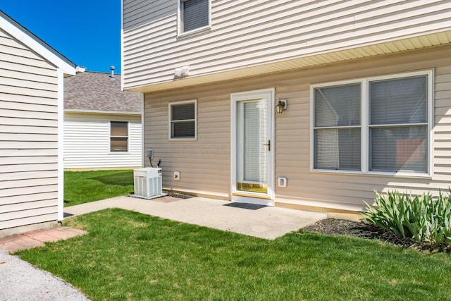 exterior space with a lawn and central AC