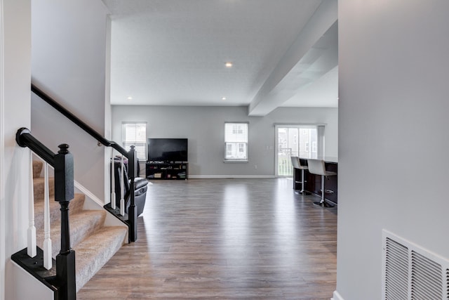 foyer entrance featuring recessed lighting, wood finished floors, visible vents, baseboards, and stairs