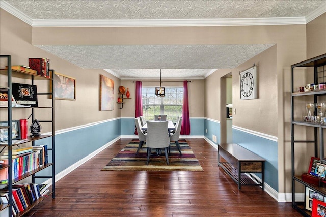 dining space featuring a textured ceiling, wood-type flooring, and baseboards