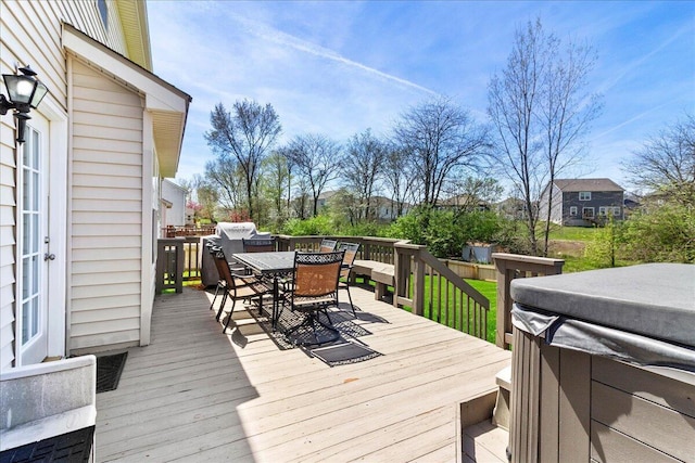 wooden terrace featuring outdoor dining area