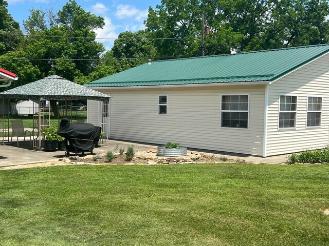 52 3rd St SE, Newark, OH 43055 - back of house with a lawn, a gazebo, and metal roof