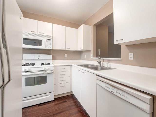 5690 Kilbury Ln Unit 120D, Hilliard, OH 43026 - kitchen with white appliances, light countertops, white cabinetry, and dark wood-type flooring