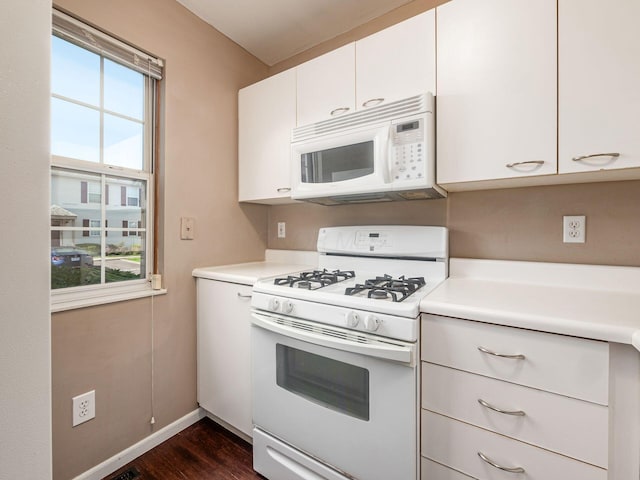 5690 Kilbury Ln Unit 120D, Hilliard, OH 43026 - kitchen with white appliances, light countertops, dark wood-style floors, and white cabinets