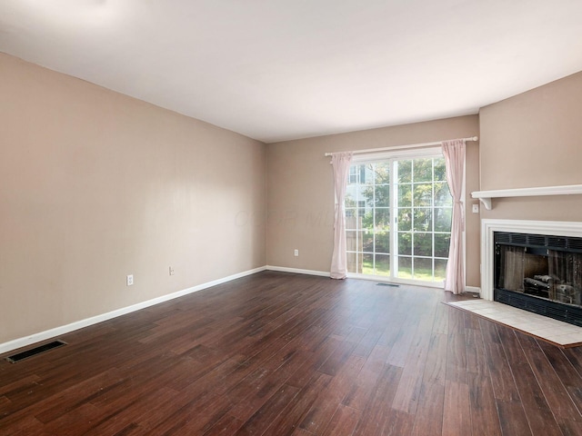 5690 Kilbury Ln Unit 120D, Hilliard, OH 43026 - unfurnished living room featuring dark wood finished floors and a fireplace with flush hearth