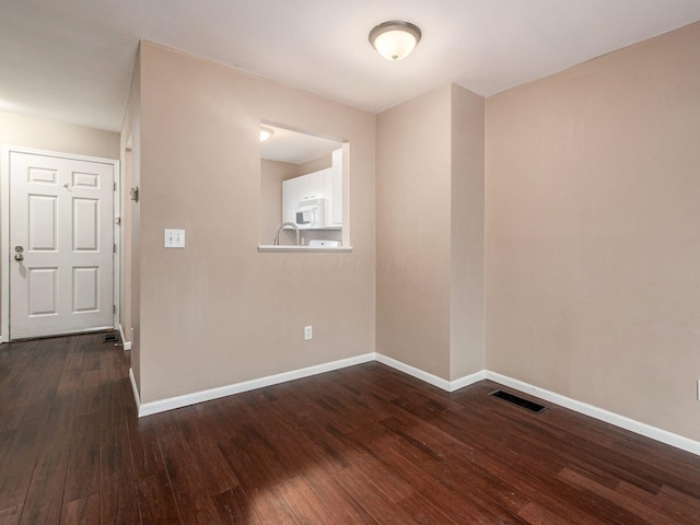 5690 Kilbury Ln Unit 120D, Hilliard, OH 43026 - empty room with dark wood finished floors