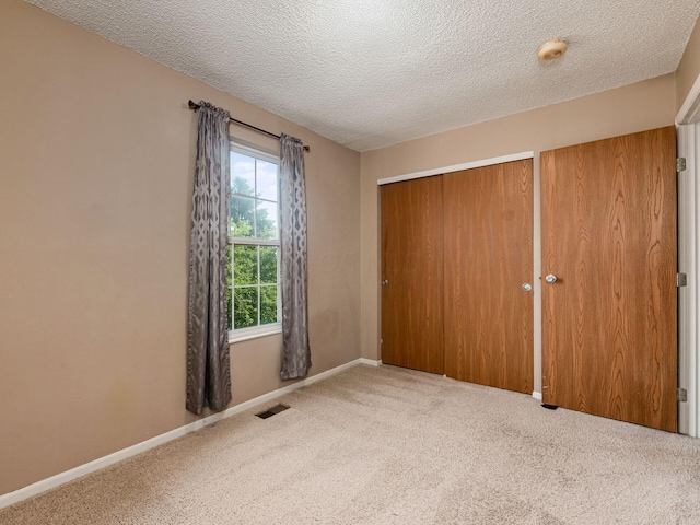 5690 Kilbury Ln Unit 120D, Hilliard, OH 43026 - unfurnished bedroom with carpet and a textured ceiling