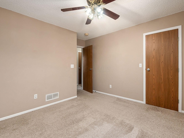 5690 Kilbury Ln Unit 120D, Hilliard, OH 43026 - carpeted spare room with a ceiling fan and a textured ceiling