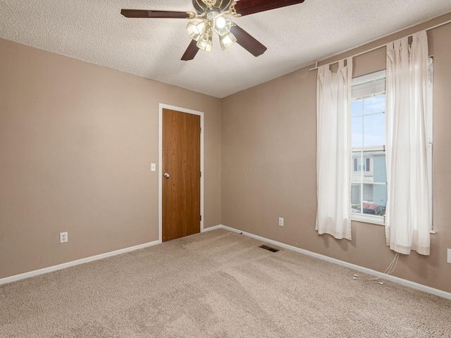 5690 Kilbury Ln Unit 120D, Hilliard, OH 43026 - carpeted empty room featuring a ceiling fan and a textured ceiling