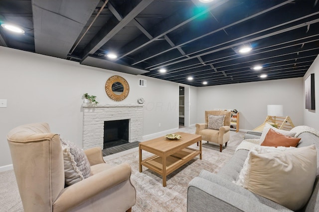 carpeted living room with baseboards and a fireplace