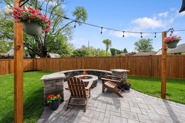 view of patio featuring a fire pit
