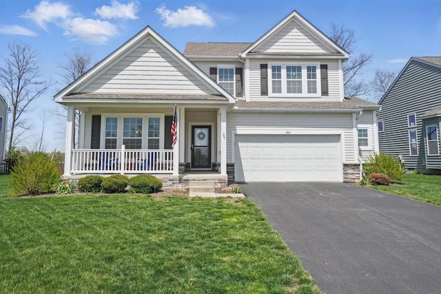 view of front facade featuring a garage, covered porch, a front lawn, and aphalt driveway