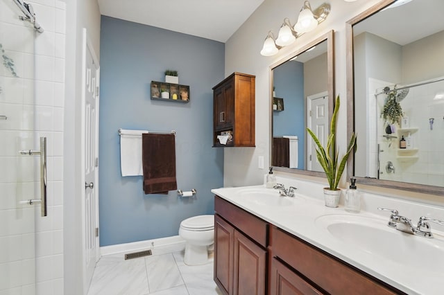full bathroom with double vanity, visible vents, tiled shower, and a sink