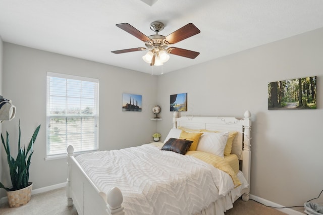 bedroom with carpet, baseboards, and ceiling fan