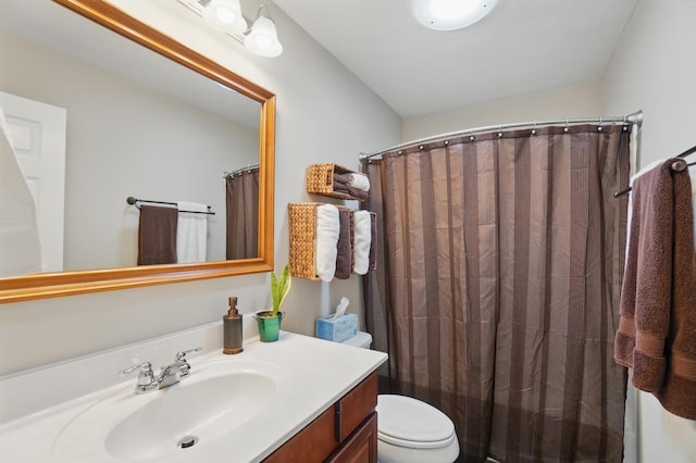 full bathroom with vanity, curtained shower, and toilet