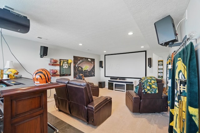 home theater room featuring recessed lighting and a textured ceiling