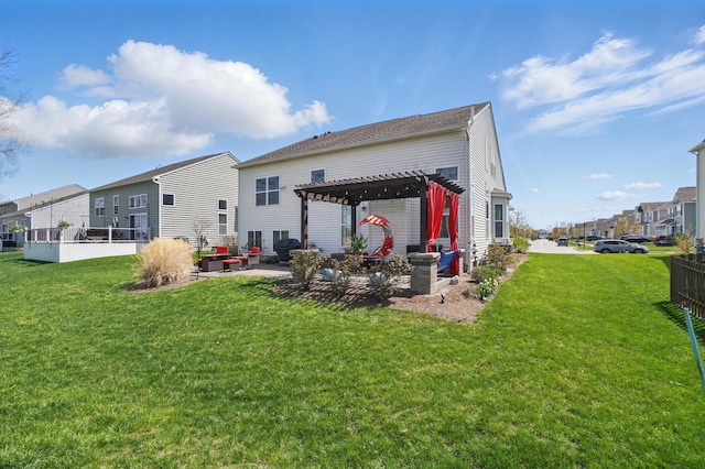 rear view of house with a pergola, a yard, a patio, and a residential view
