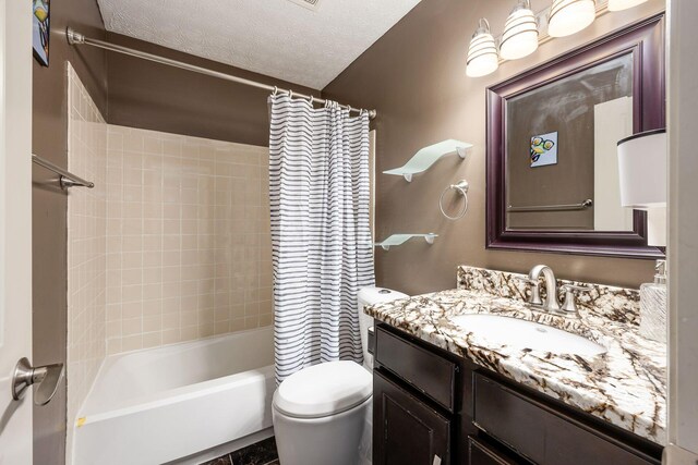 full bath featuring toilet, a textured ceiling, shower / bathtub combination with curtain, and vanity