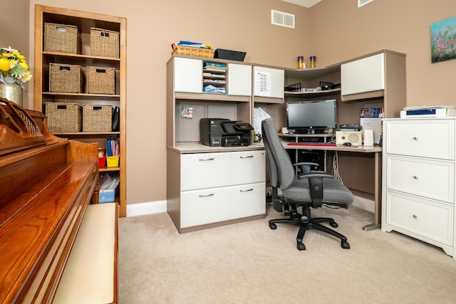 office with baseboards, light carpet, and visible vents