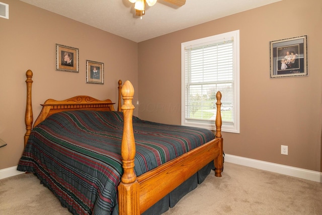 bedroom with baseboards, carpet, ceiling fan, and visible vents