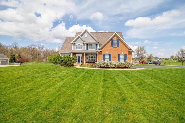 craftsman house featuring a porch, brick siding, fence, and a front lawn