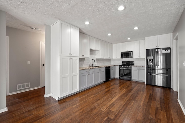 6709 Axtel Dr Unit 5A, Canal Winchester, OH 43110 - kitchen with a sink, black dishwasher, stainless steel refrigerator with ice dispenser, range with gas cooktop, and visible vents