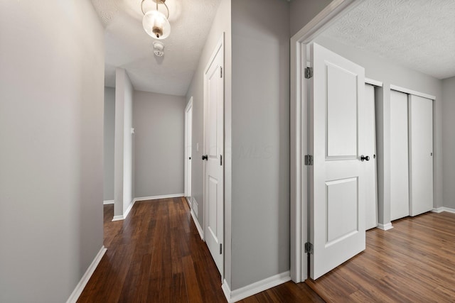 6709 Axtel Dr Unit 5A, Canal Winchester, OH 43110 - hallway featuring baseboards, a textured ceiling, and wood finished floors