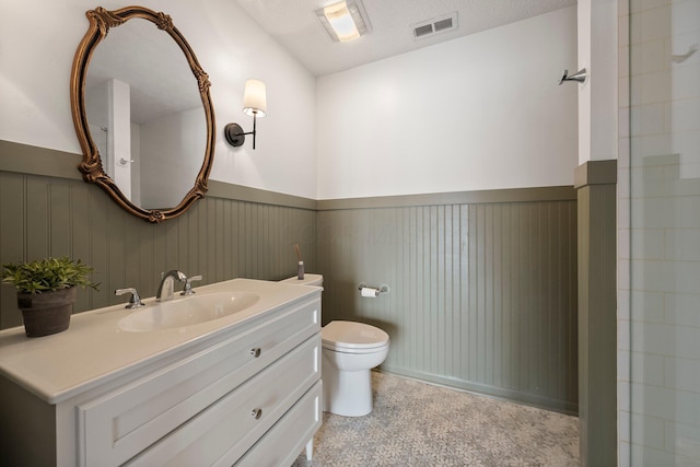 6709 Axtel Dr Unit 5A, Canal Winchester, OH 43110 - bathroom featuring vanity, toilet, a wainscoted wall, and visible vents