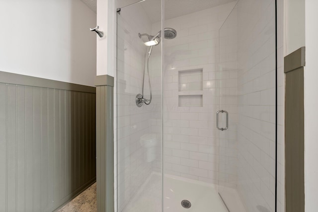 6709 Axtel Dr Unit 5A, Canal Winchester, OH 43110 - bathroom with wainscoting and a stall shower