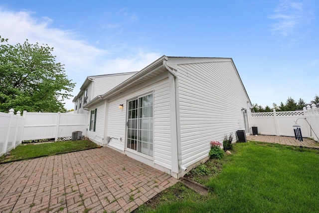 6709 Axtel Dr Unit 5A, Canal Winchester, OH 43110 - view of home's exterior with a yard, central AC unit, a patio, and a fenced backyard