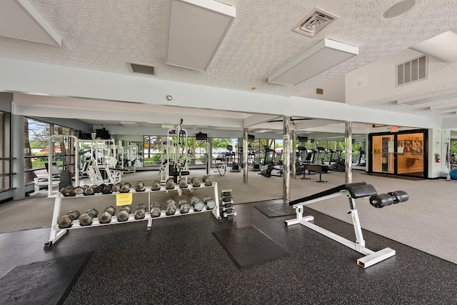6709 Axtel Dr Unit 5A, Canal Winchester, OH 43110 - exercise room with a textured ceiling and visible vents
