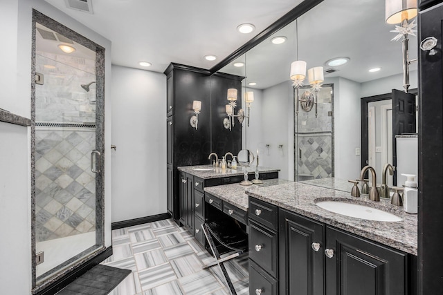 bathroom featuring a sink, a shower stall, and visible vents