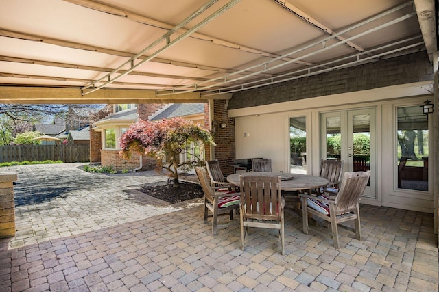 view of patio / terrace with fence, french doors, and outdoor dining space