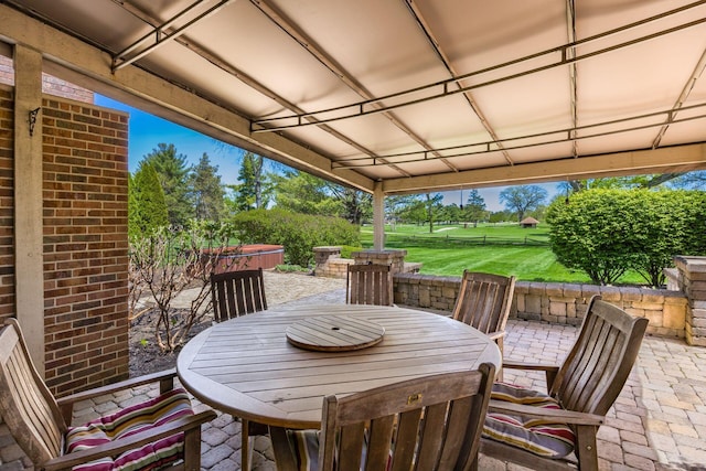 view of patio / terrace with outdoor dining area and fence