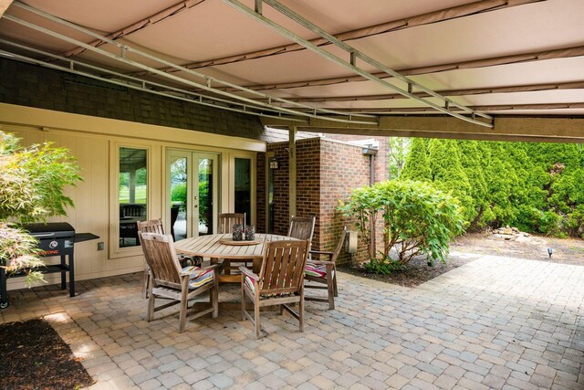 4070 Lyon Dr, Upper Arlington, OH 43220 - view of patio featuring french doors, a grill, and outdoor dining space