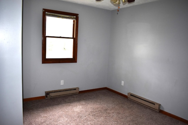 carpeted spare room featuring a baseboard radiator, a ceiling fan, and baseboards