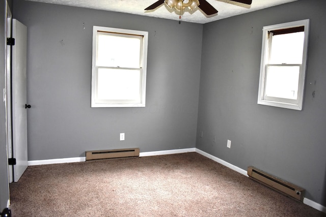 unfurnished room with baseboard heating, a ceiling fan, a baseboard heating unit, carpet, and baseboards