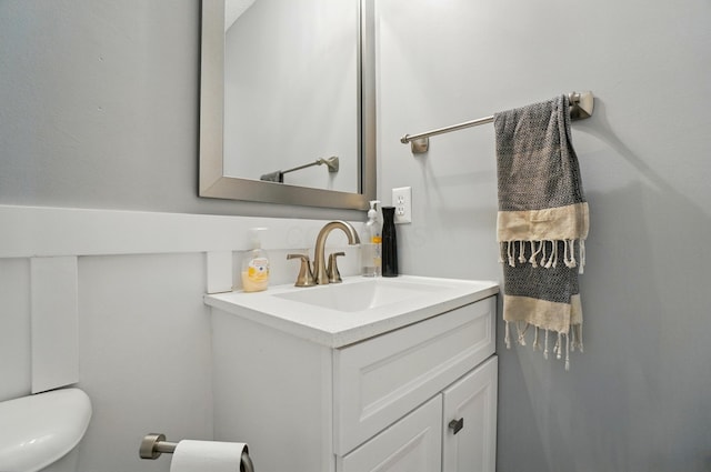 half bath with vanity and toilet