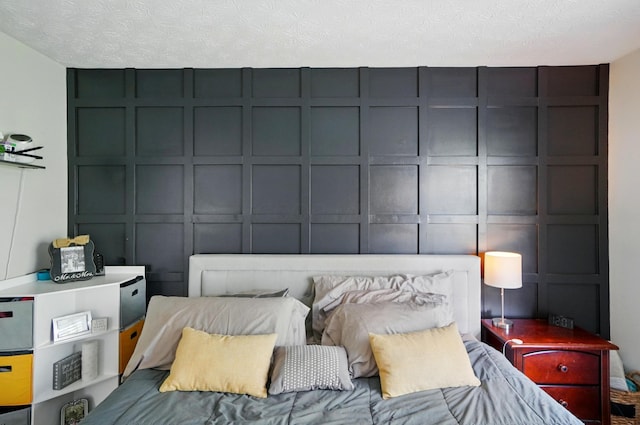 bedroom featuring a decorative wall